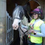 Pauline and her horse Sheila in the porch of the church